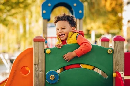 laughing child on playset