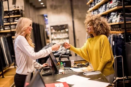 Retail worker ringing up customer